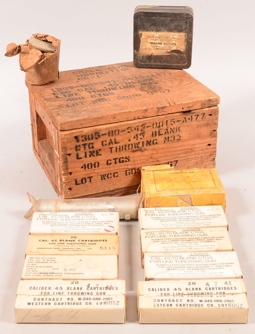 Collector ammo lot: wood box marked for line throwing: Collector ammo lot: wood box marked for line throwing cartridges with (8) boxes 45-70 line throwing blanks, a tin of (5) "Tow Line Rockets", a box of (10) German flares unopened, and a 37mm parachute 