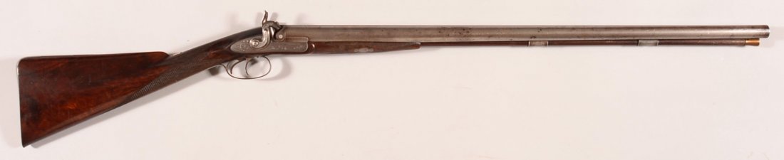Engraved Philip Wilson & Co., Philadelphia, 10 gauge do: Engraved Philip Wilson & Co., Philadelphia, 10 gauge double barrel SxS percussion shotgun sn 207 having 31" Damascus barrels, fine scroll engraved locks with game birds, hunting dog on the trigger gua