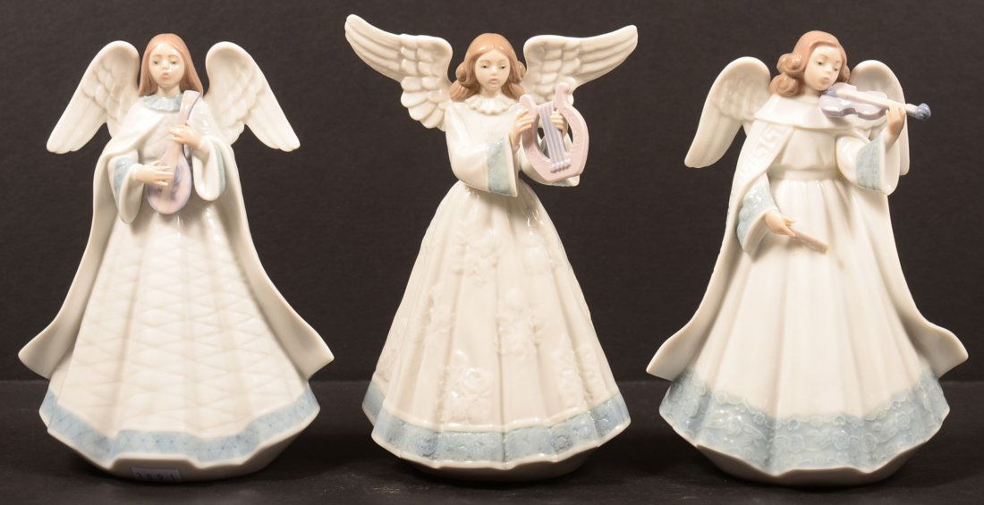 Three Lladro Porcelain Angel Tree Topper Figures.: Three Lladro Porcelain Angel Tree Topper Figures. (Angelic Melody)#5963, (Heavenly Harpist)#5830, (Angelic Violinist)#6126, all with original boxes, 7"h. Condition: Very good, harp loose from figure,