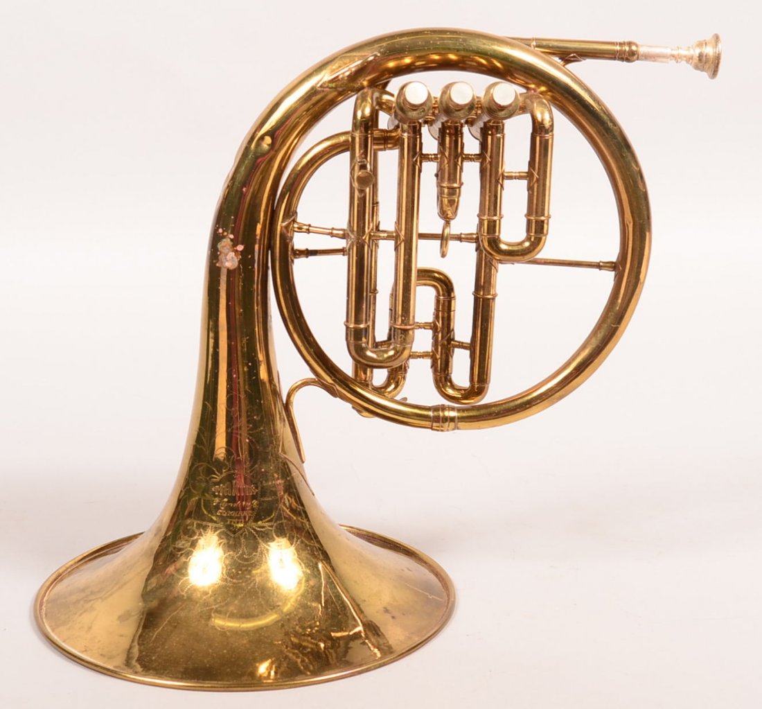 1960's or 1970's Martin French Horn with case. Engraved: 1960's or 1970's Martin French Horn with case. Engraved Martin handcraft Elkhart Ind. 15"h. diameter of horn 11-1/4", working condition with one value sticking, Condition: Good with some dents and ble