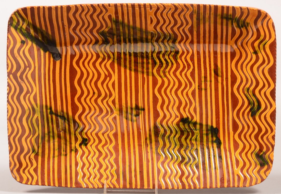 Large Breininger Redware Pottery Slip Decorated Platter: Large Breininger Redware Pottery Slip Decorated Platter with coggle wheel edge. Signed on base "Breininger Pottery, Robesonia, PA, June 29, 1989, A beautiful day!". 13-1/2" x 19-1/4". Condition: Very