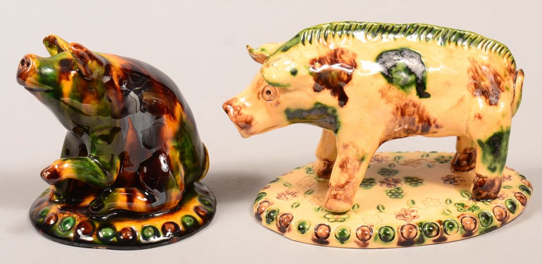 Two James J. Nyeste Pottery Swine Figures. First is a: Two James J. Nyeste Pottery Swine Figures. First is a seated pig with outreached front leg, slab base signed "James J. Nyeste, Seven Valleys, PA, 1988, Mustard Kinard's trick pig", 4-1/4"h. Second is