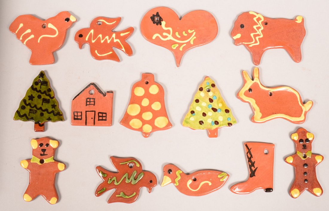 14 Various glazed and Decorated Breininger Redware: 14 Various glazed and Decorated Breininger Redware Pottery Christmas Tree Ornaments. Most dating from 1980's. 2-1/4" to 4"l. Condition: Very good.