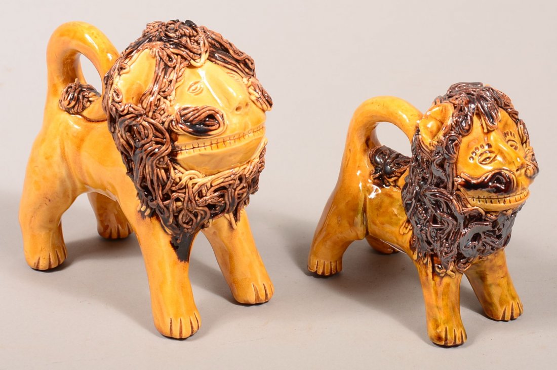 Two James J. Nyeste Redware Pottery Lion Figures,: Two James J. Nyeste Redware Pottery Lion Figures, (Copies of Shenandoah pottery). Standing lion with yellow ground and brown mottled glazed, applied spaghetti pottery manes and tail, smaller one dated
