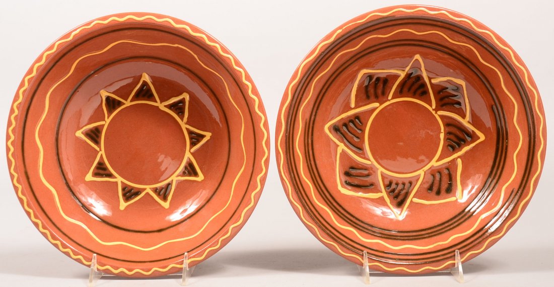 Two Breininger Redware Pottery Snow Hill Bowls. Both: Two Breininger Redware Pottery Snow Hill Bowls. Both signed and dated December 1997. 10-3/4" diam. Condition: Very good.