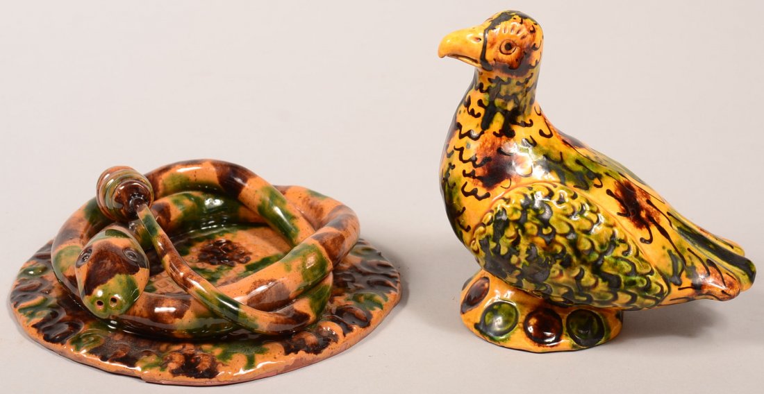 Two James J. Nyeste Redware Pottery Animal Figures.: Two James J. Nyeste Redware Pottery Animal Figures. First is a coiled rattlesnake on a round slab base signed "James J. Nyeste, Seven Valleys, PA, 1987", 7-1/4" diam. Second is a bird on round base si
