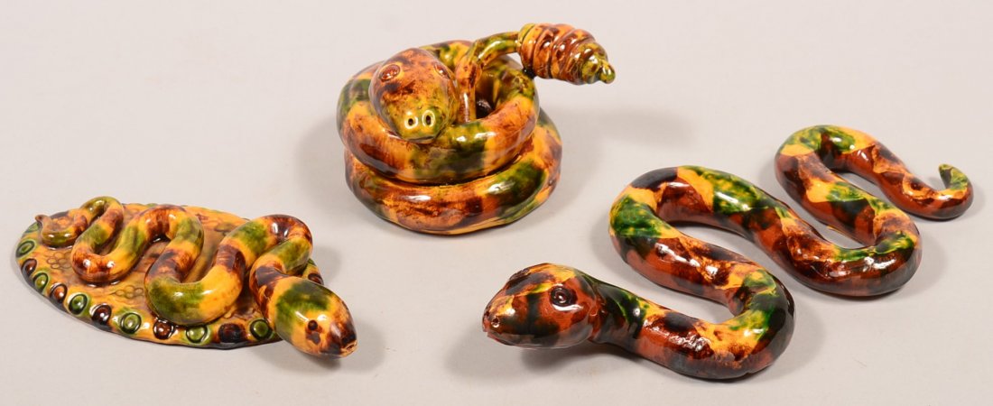 Three Various James J. Nyeste Hand Molded Redware: Three Various James J. Nyeste Hand Molded Redware Pottery Snake Figures. 4" to 10-1/2"l. Condition: Very good.