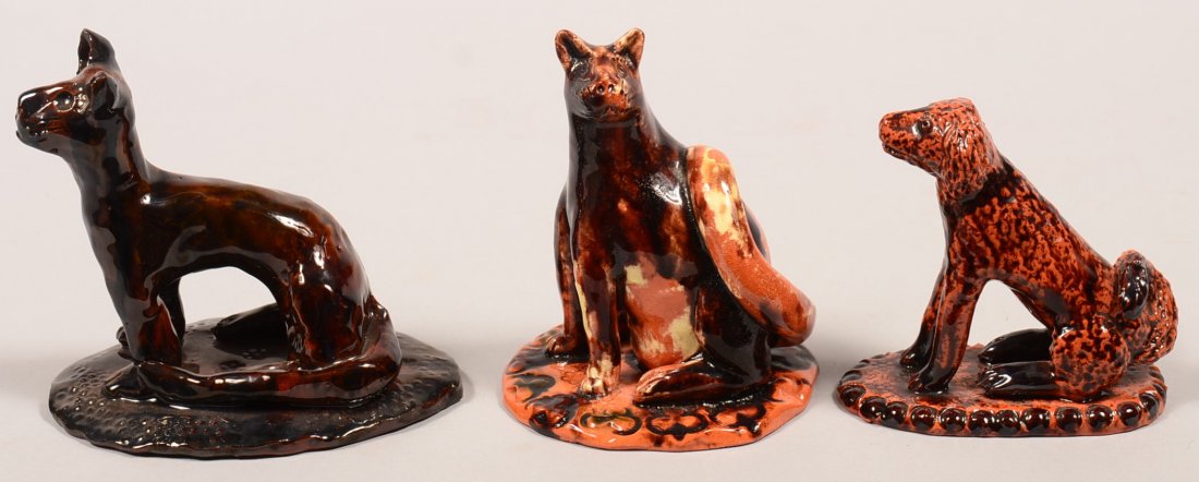 Three James J. Nyeste Hand Molded Redware Pottery: Three James J. Nyeste Hand Molded Redware Pottery Animal Figures on slab bases. First is a seated cat, base signed "Samuel's Cat, James J. Nyeste 1983", 5"h. Second is a seated cat, base signed "Calic