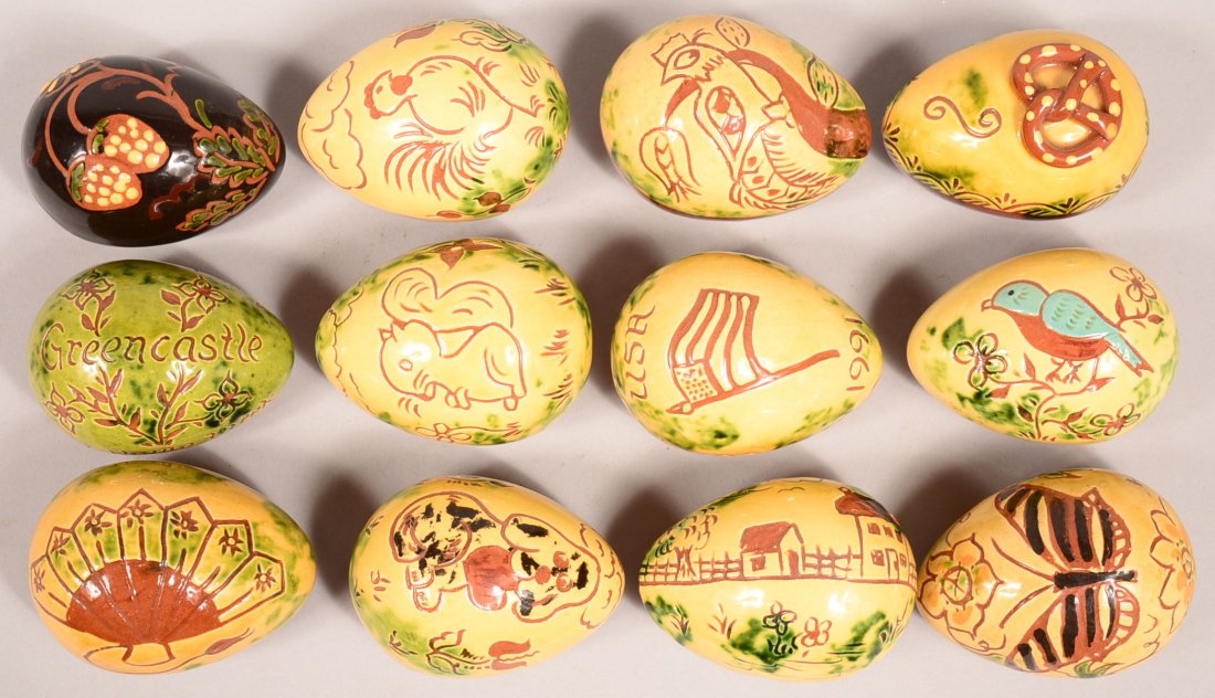 Lot of 12 Large Breininger Redware Pottery Eggs. Having: Lot of 12 Large Breininger Redware Pottery Eggs. Having various glazes and/or sgrafitto decoration. 3" to 3-1/2" long. Condition: Very good.