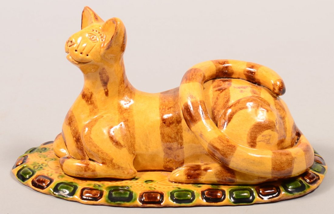 Large James J. Nyeste Hand Molded Redware Reclining cat: Large James J. Nyeste Hand Molded Redware Reclining cat Figure. Folky tiger stripe cat mounted on an oval slab base signed "James J. Nyeste, Seven Valleys, Penna, Feb. 14 1992" 9-1/2"l. Condition: Ver