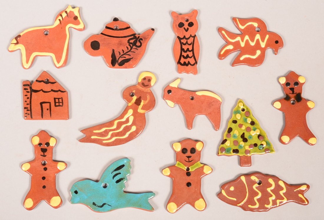 13 Various glazed and Decorated Breininger Redware: 13 Various glazed and Decorated Breininger Redware Pottery Christmas Tree Ornaments. Most dating from 1980's. 2-1/4" to 4"l. Condition: Very good.