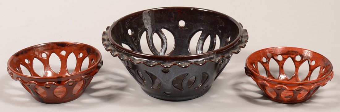 Lot of Three Breininger Redware Pottery Reticulated: Lot of Three Breininger Redware Pottery Reticulated Bowls. All are signed and dated from the 1980's, 5-1/2" to 9-1/4" diam. Condition: Very good.