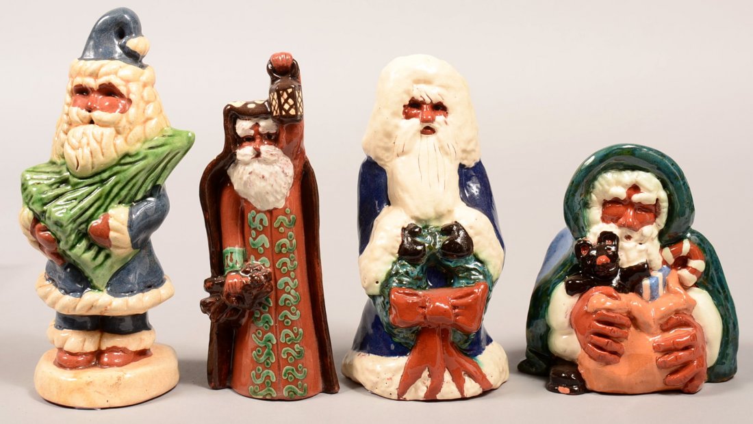 Four Turtlecreek Redware Pottery Molded Santa Figures.: Four Turtlecreek Redware Pottery Molded Santa Figures. All are signed. 5-1/4" to 8h. Condition: Very good.
