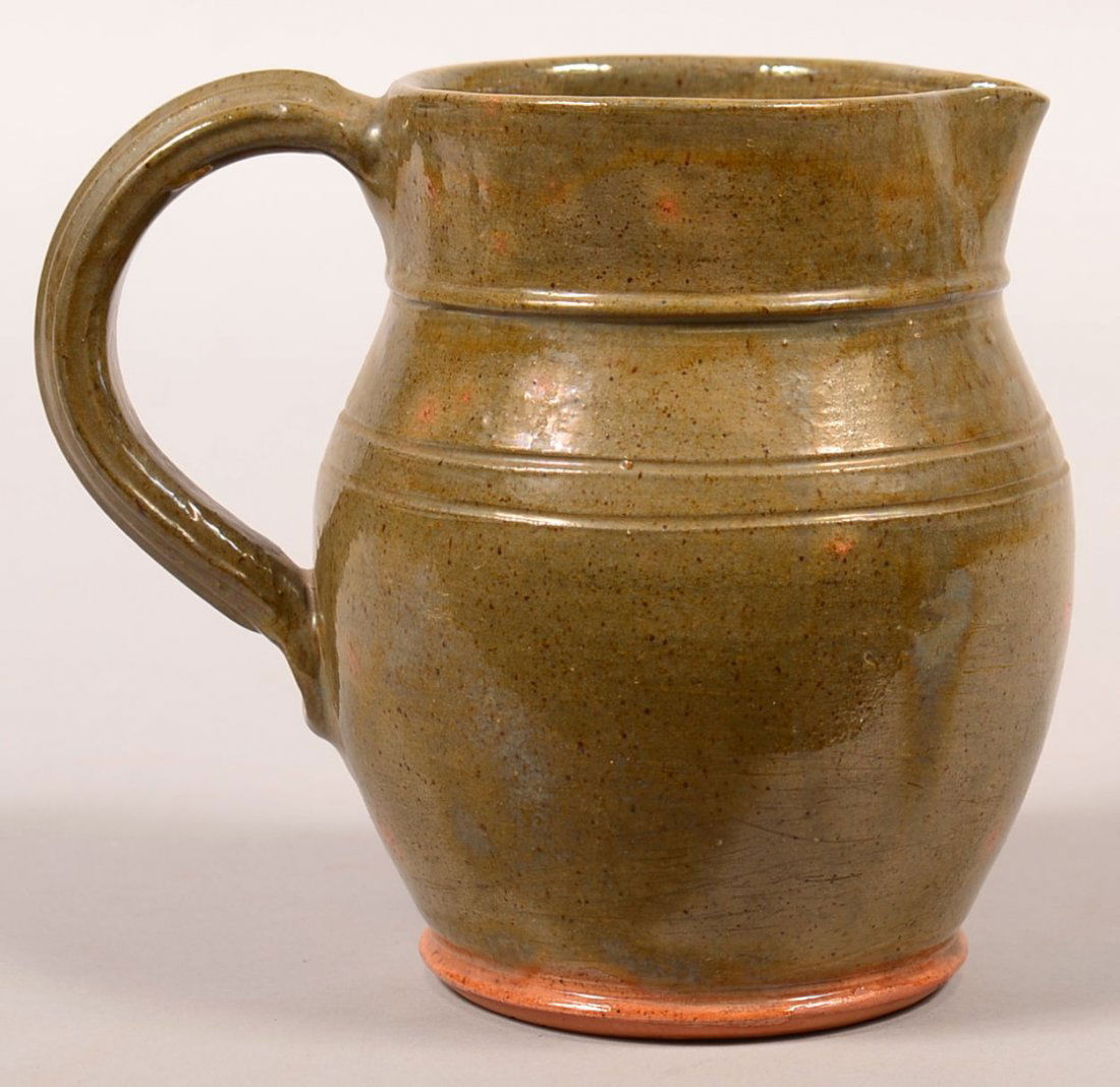 Stahl Pottery Green Glazed Redware Bulbous Form: Stahl Pottery Green Glazed Redware Bulbous Form Pitcher. Signed on base "Made in Stahls Pottery by Thomas Stahl, May 14, 1938". 6-1/2"h. Condition: Very good.