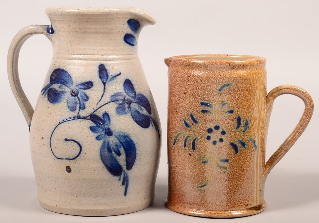 Two Contemporary Cobalt Blue Slip Decorated Stoneware: Two Contemporary Cobalt Blue Slip Decorated Stoneware Pottery Pitchers. 1st: Eldreth Pottery bulbous pitcher with floral decoration, 9-1/4"h. 2nd: Unsigned straight side pitcher with stylized floral d