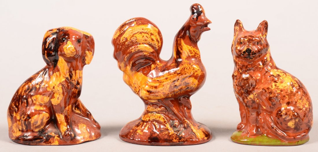 Three Breininger Redware Pottery Animal Figures. Seated: Three Breininger Redware Pottery Animal Figures. Seated dog dated 1994, 3-1/2"h., seated cat dated 2004, 3-3/4"h. and a standing rooster dated 1994, 4-1/2"h. Condition: Very good.