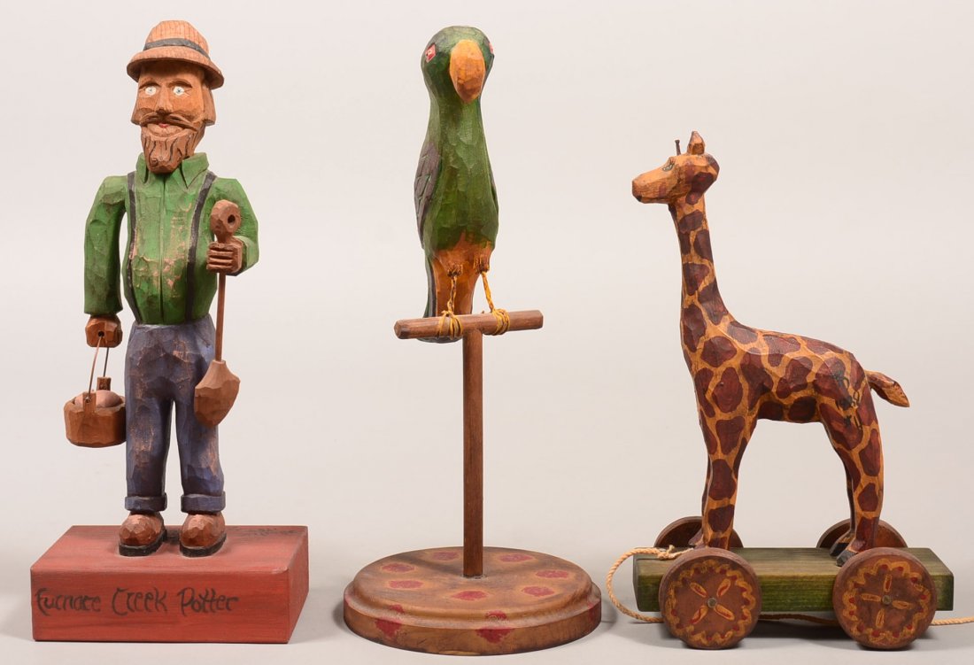 Three Jonathan Bastian Carved and Painted Wood Figures.: Three Jonathan Bastian Carved and Painted Wood Figures. Lester Breininger "Furnace Creek Potter". Signed "J. Bastian #2, 1987", 12"h., Parrot on perch signed "Jonathan Bastian 1987", 12"h. and giraffe