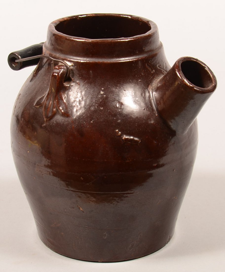Late 19th/Early 20th Century Brown Glazed Earthenware: Late 19th/Early 20th Century Brown Glazed Earthenware Batter Jug. Wire swing bail handle with turned wood grip. 8-3/4"h. Condition: Very good, missing lid and spout cap.