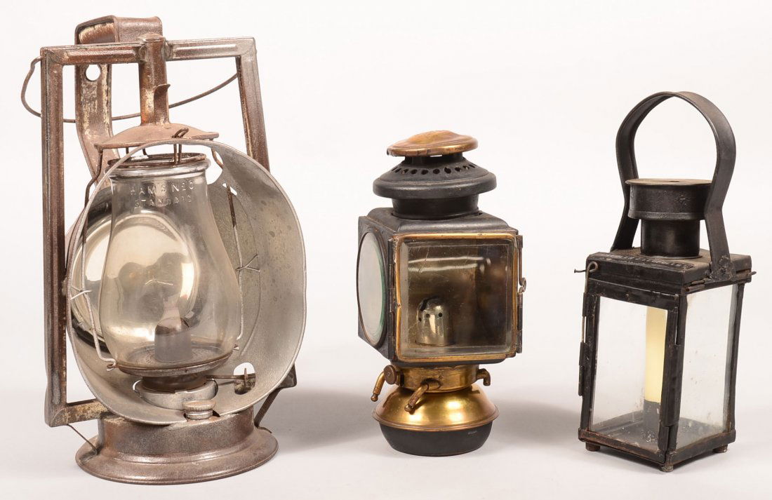 Three Various Lanterns. Dietz Acme Inspector,: Three Various Lanterns. Dietz Acme Inspector, 14-1/4"h., E. & J. Detroit. Mich. automobile Lamp, 10"h. Candle lantern painted black marked Fiedler Leopolld, 12"h. Condition: Loss of paint and repaint.