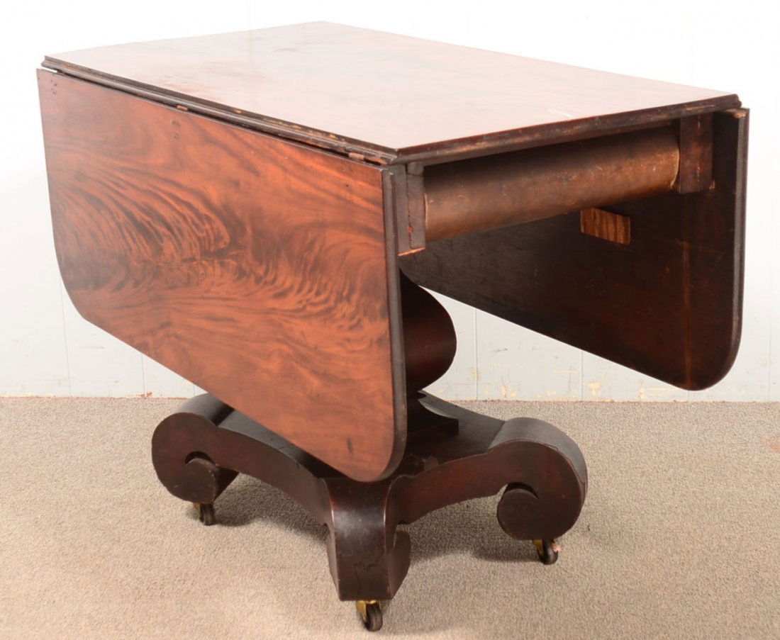 American Empire Mahogany Pedestal Base Dropleaf Table.