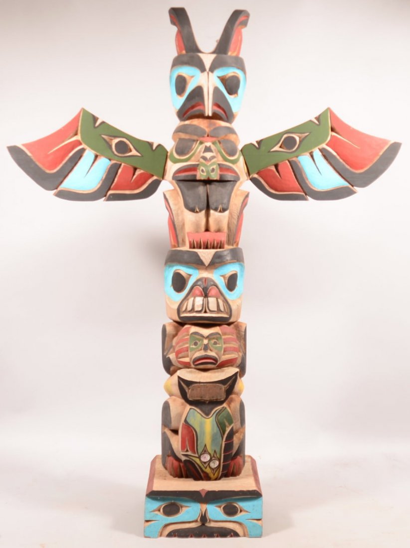 20th Century Full Size Carved Totem Pole. Having eagle: 20th Century Full Size Carved Totem Pole. Having eagle and other polychrome painted figures, attributed to William Kuhnley Sr., signed on back with letter K-, 82"h. x wingspan 64"w. x 17-1/2"d. Condit