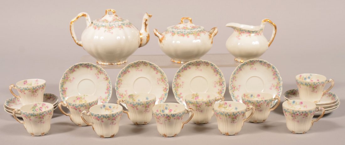 Theodore Haviland Limoges France Floral Transfer: Theodore Haviland Limoges France Floral Transfer Decorated Porcelain 25 Piece Tea Service. Set consists of: Teapot, covered sugar bowl, cream pitcher, 11 cups and 11 saucers. Hollowwares have gold han
