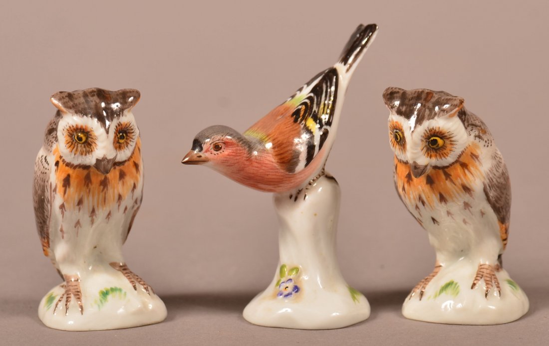 Three Miniature Meissen Porcelain Figurines. Two owls: Three Miniature Meissen Porcelain Figurines. Two owls and a song bird. All hand painted in natural colors. All with blue cross sword mark. 2" to 2-1/2" h. Condition: Very Good.
