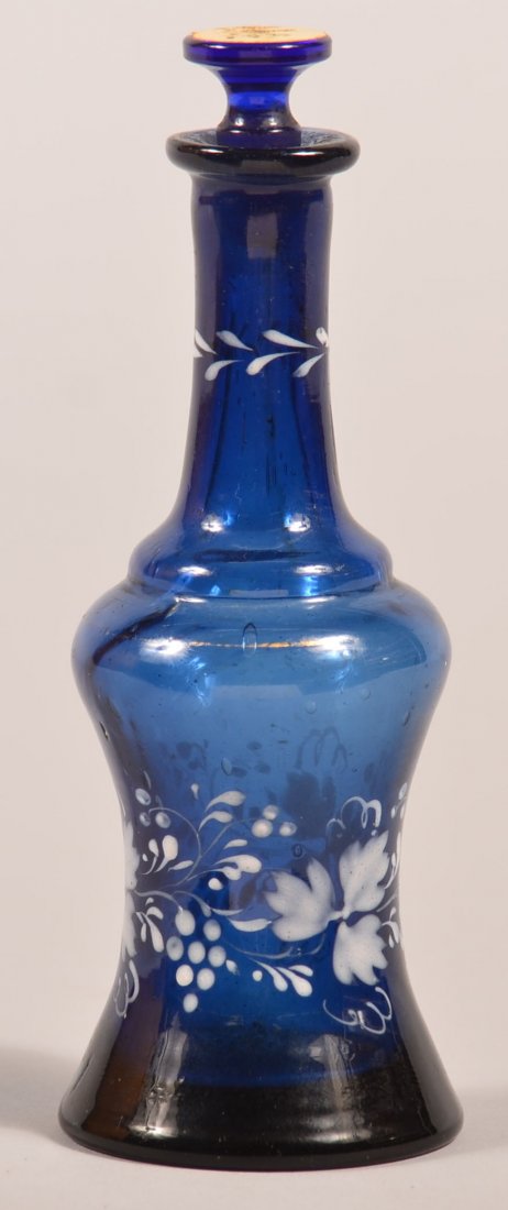 Antique Cobalt Blue Enamel Decorated Perfume Bottle.: Antique Cobalt Blue Enamel Decorated Perfume Bottle. Concave body with elongated neck, grape and leaf white enamel decoration. Blown with broken pontil. Stopper with original label "Atar Myosotis" (Fo