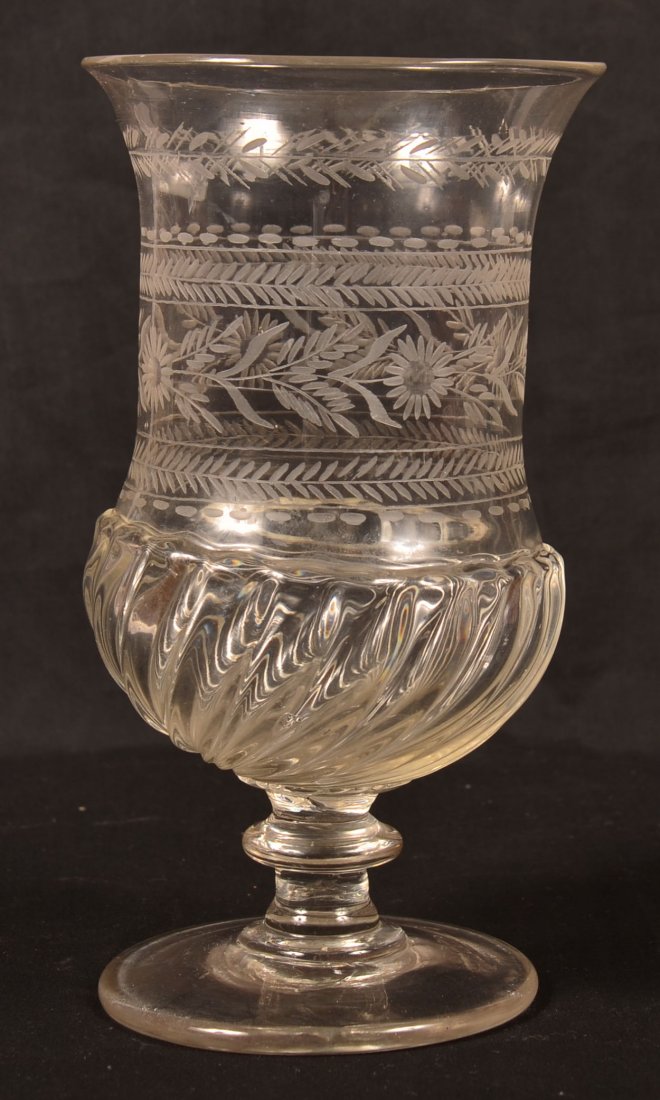 Blown Colorless Glass Footed Vase. Flared rim, engraved: Blown Colorless Glass Footed Vase. Flared rim, engraved bands of floral and foliate designs, swirled base with button knop stem, broken pontil. 8-1/2"h. Condition: Very Good.