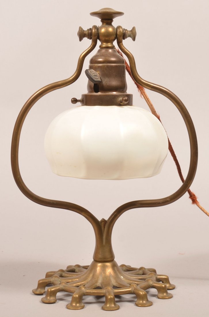Arts and Crafts Period Bronze Desk Lamp with Quezal: Arts and Crafts Period Bronze Desk Lamp with Quezal Shade. Unsigned 12 hoof-foot base and signed "Quezal" opaque white iridescent 10 panel art glass shade. 13-1/2" high overall. Condition: Very good,