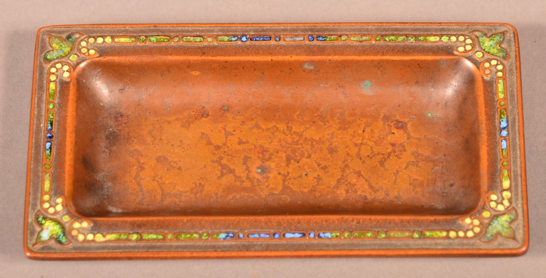 Louis C. Tiffany furnaces, Inc. Enameled Bronze Small: Louis C. Tiffany furnaces, Inc. Enameled Bronze Small Desk Tray. Blue, green and yellow enameling with stylized leaf corners. 5" long. Condition: Very good, nice patina, minor wear.