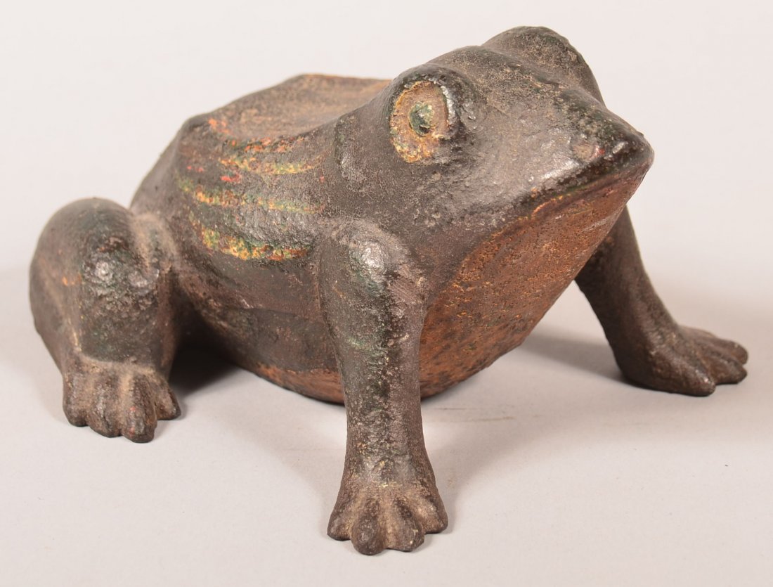 Early 20th Century Solid Cast Iron Frog Form doorstop.: Early 20th Century Solid Cast Iron Frog Form doorstop. Painted in natural colors. 5-1/2" long. Condition: good with some rust and wear.
