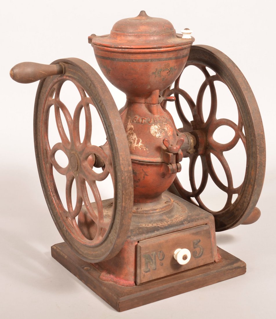 Enterprise M.F.G. Co. No. 5 Cast Iron Coffee Mill.: Enterprise M.F.G. Co. No. 5 Cast Iron Coffee Mill. Original red ground with applied decals. 17" high. Condition: Good but well worn, losses to finish.