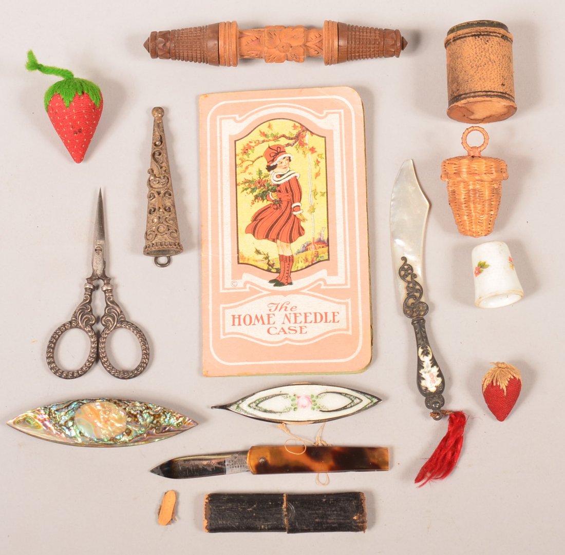 Lot of 11 Various Vintage Sewing Items. Including a: Lot of 11 Various Vintage Sewing Items. Including a carved wood needle case, 4-1/2" long, abalone and enameled tatting shuttle, strawberry pin cushions, scissors and case, etc. Condition: fair to good
