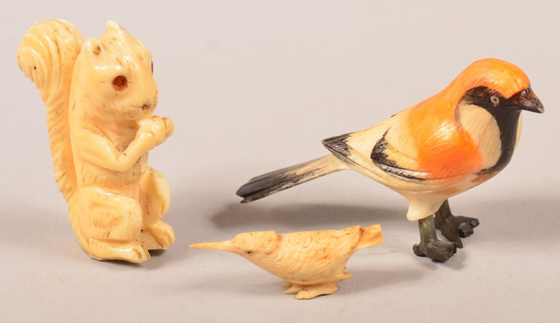 Three Antique Carved Ivory Animal Figures. Squirrel: Three Antique Carved Ivory Animal Figures. Squirrel eating a nut, 2-1/8" high, an Oriole and a Snipe. Condition: Good.