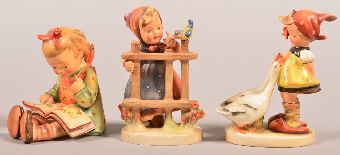 Three Hummel Figures; Signs of Spring # 203/1, Bookworm: Three Hummel Figures; Signs of Spring # 203/1, Bookworm # 8, Goose Girl # 47/0, all with Tmk-2, 4-1/2"h. - 5-1/2"h. Condition: Very good.