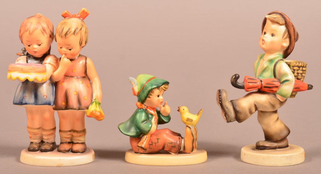Three Hummel Figures; Happy Birthday # 176/0, Singing: Three Hummel Figures; Happy Birthday # 176/0, Singing Lesson # 63, Globe Trotter # 79, all with Tmk-3, 3-5-1/4"h. Condition: Very good.