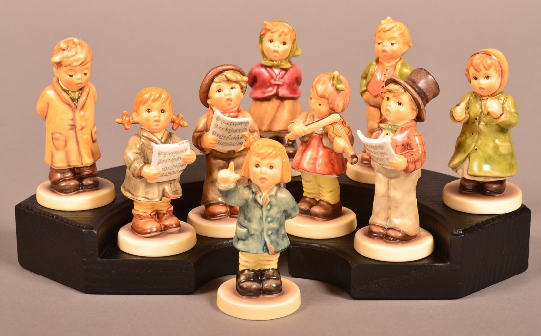 Collector's Club Kinder Choir Hummel Figure Set. Nine: Collector's Club Kinder Choir Hummel Figure Set. Nine piece set with tiered stands, missing lamp post, all with original boxes, all Tmk-8, tallest 4"h. Condition: Very good and missing lamp post.