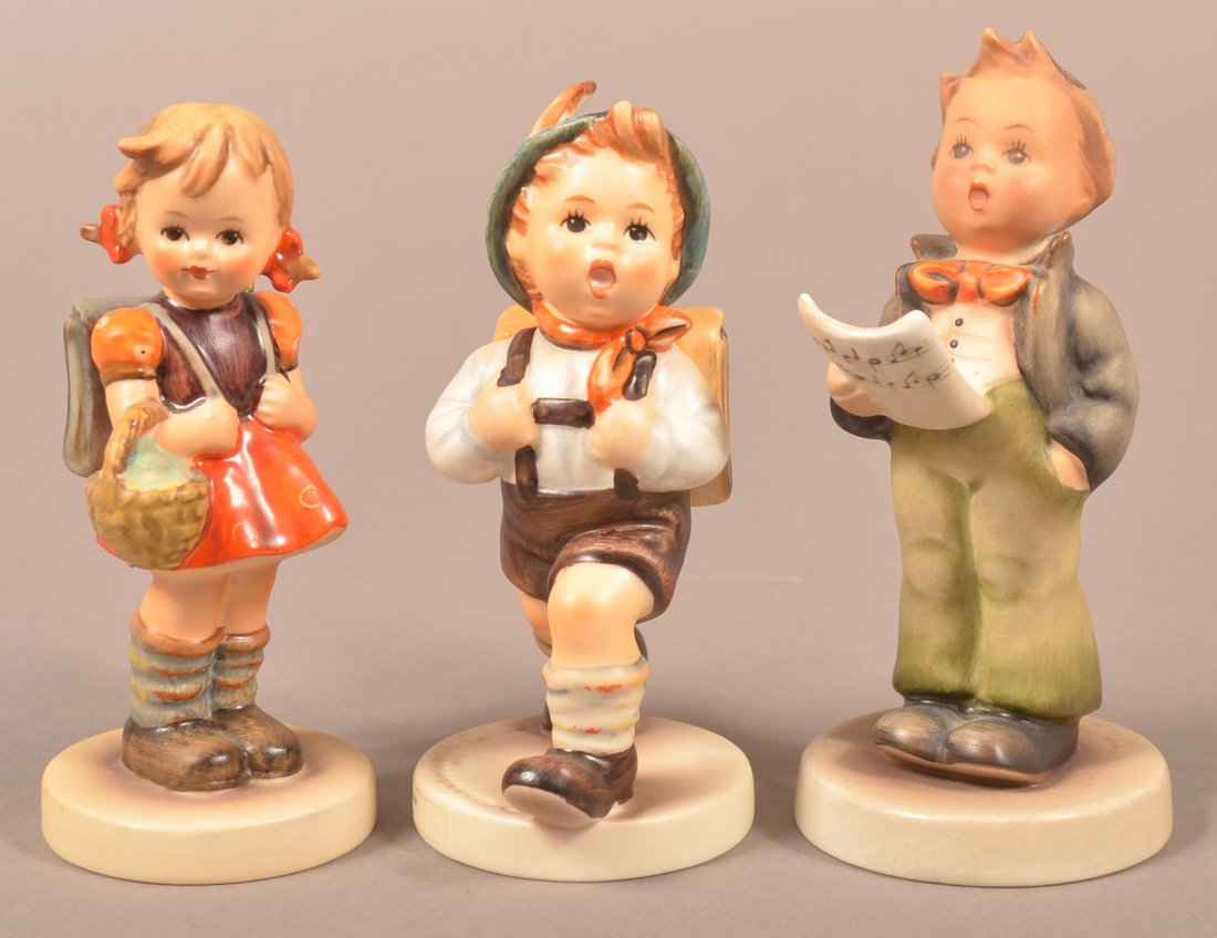 Three Hummel Figure; School Girl # 81 2/0,Tmk-5, School: Three Hummel Figure; School Girl # 81 2/0,Tmk-5, School Boy # 82 2/0, Tmk-7 with original box, Soloist # 135, Tmk-2, 4-1/2"- 4-3/4"h. Condition: Very good.