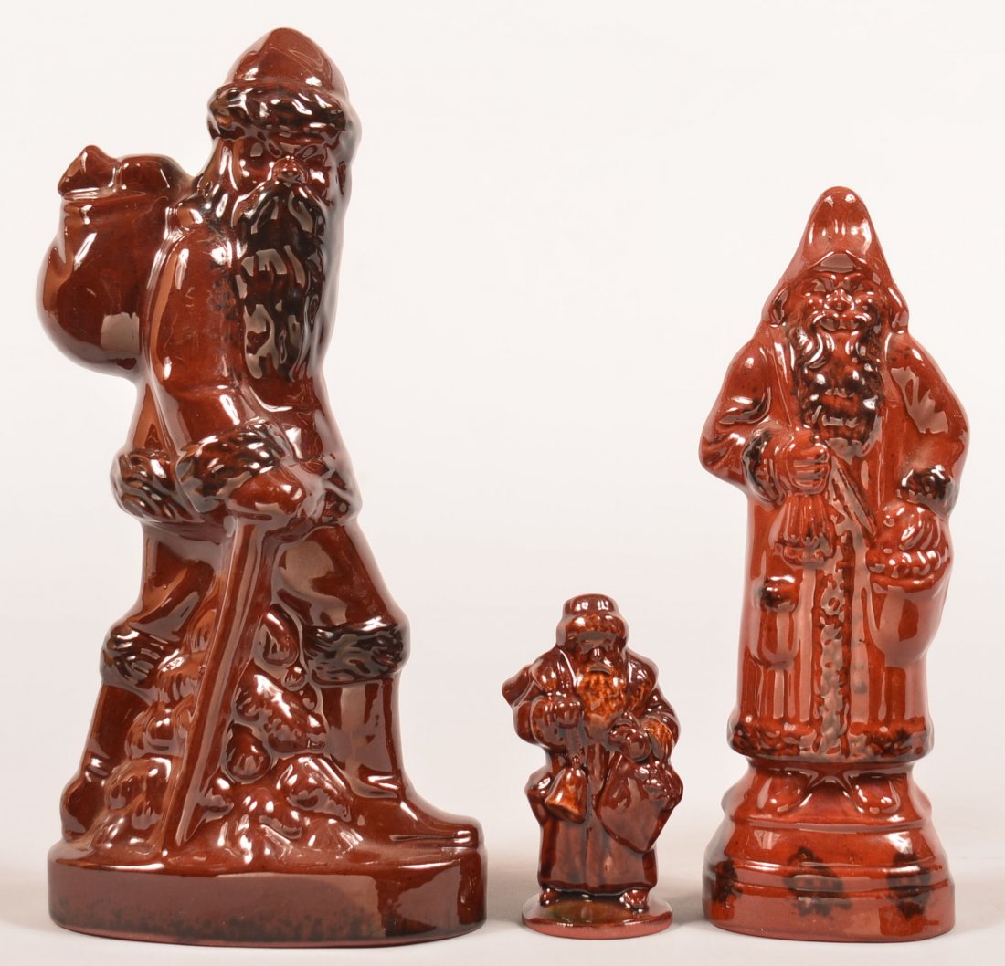 Three Foltz Redware Pottery Santa Figures. Two signed: Three Foltz Redware Pottery Santa Figures. Two signed and dated 1985 and 91, one unsigned, tallest 9-3/4"h. Condition: Very good.