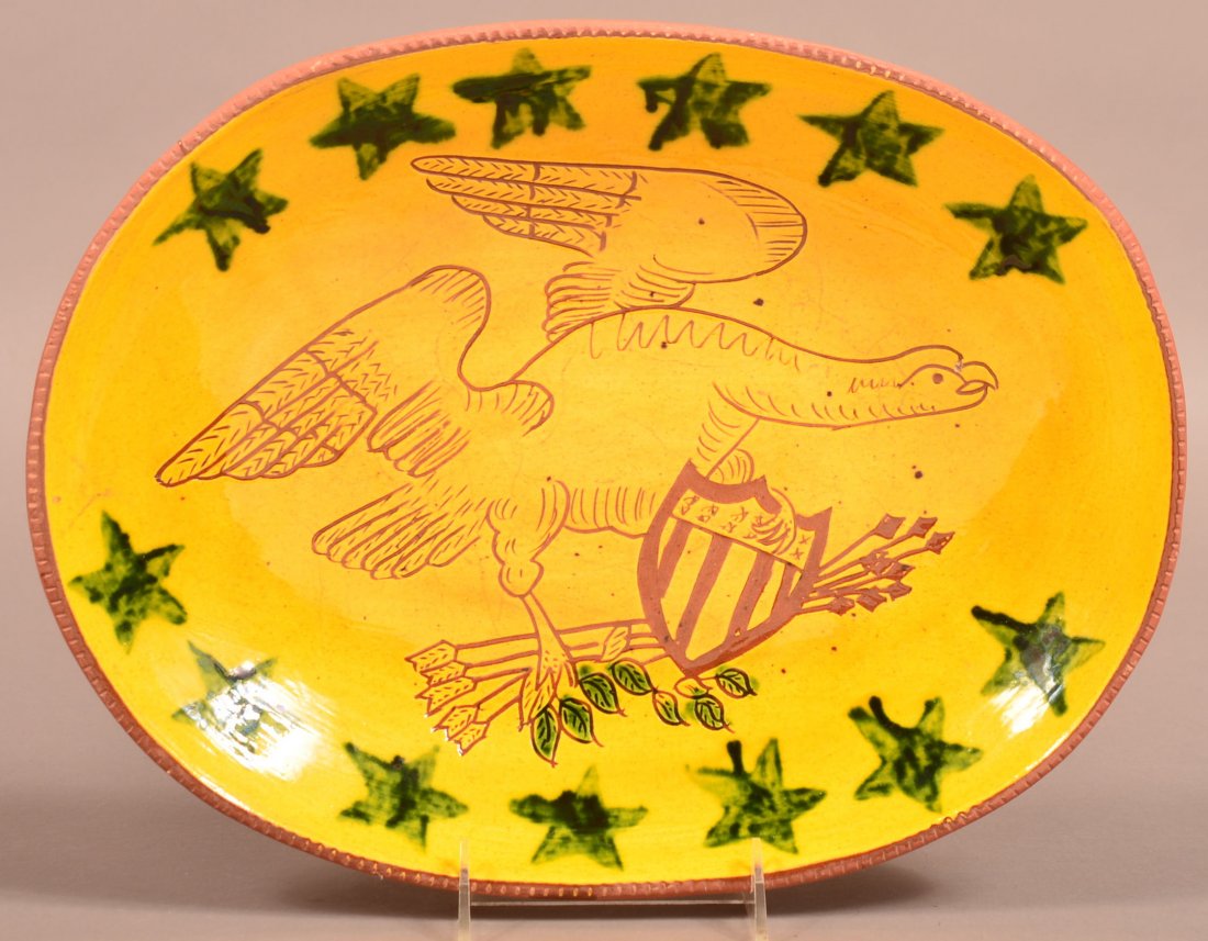 Breininger Redware Pottery Eagle Decorated Platter.: Breininger Redware Pottery Eagle Decorated Platter. Sgraffito and slip decorated American spreadwing eagle with shield, Signed B & L Breininger 1976, 14-1/2"dia. Condition: Very good.