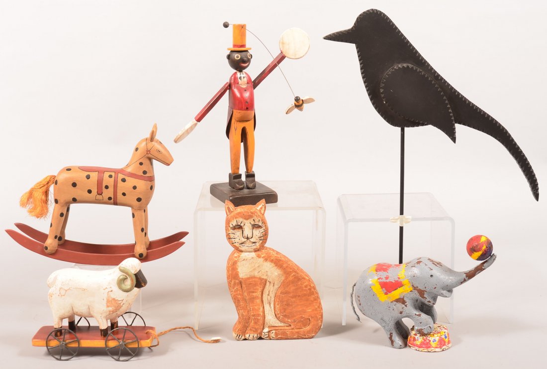 Lot of Folk Art Carvings. Including black man swatting: Lot of Folk Art Carvings. Including black man swatting a bee whirly gig, signed and dated T B Alfred 141/150, 11"h. , cat and sheep pull toy by Pearson signed and dated 1992 and 93, A. Mohr 1986 rocki