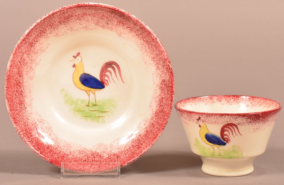 Cybis Rooster Red Spatter Cup and Saucer. Three color: Cybis Rooster Red Spatter Cup and Saucer. Three color rooster with red spatter border, Condition: Very good.
