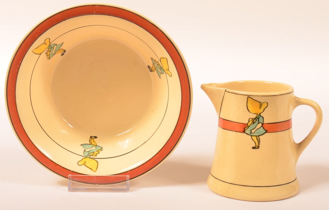 Two Roseville Pottery Sunbonnet Pattern Juvenile Ware: Two Roseville Pottery Sunbonnet Pattern Juvenile Ware Pieces. Cereal bowl and cream pitcher, but stamped Rv. Bowl 2"h. x 6"dia. Pitcher 3-1/2"h. Condition: Bowl with edge nip and pitcher with spout re