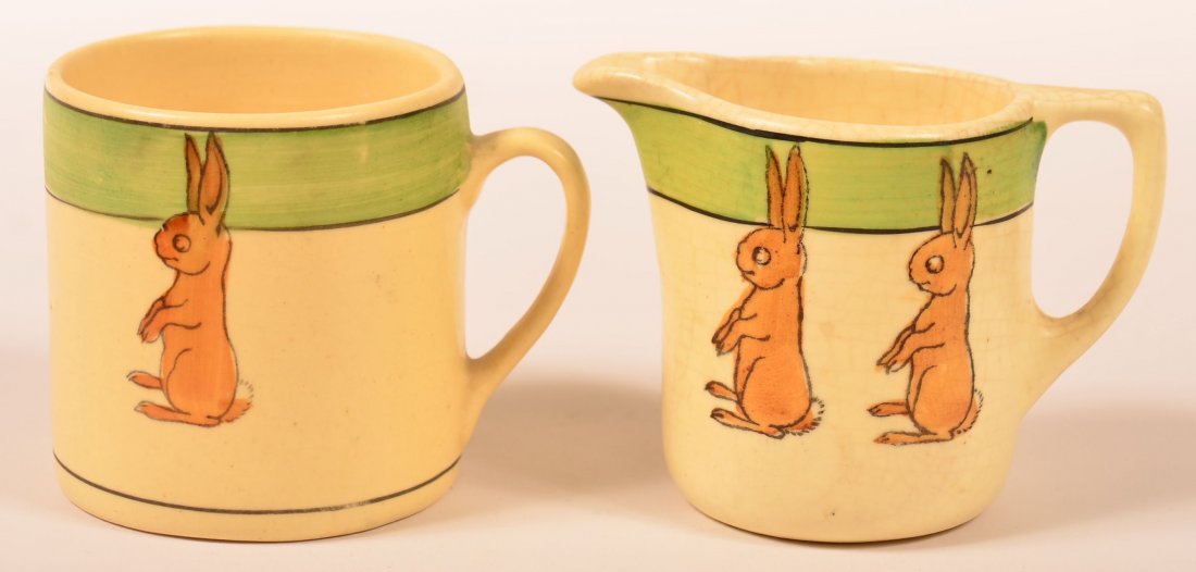 Two Roseville Pottery Juvenile Ware Rabbit Pattern: Two Roseville Pottery Juvenile Ware Rabbit Pattern Pieces. Handled Mug signed RV and stamped with number 2, and Cream Pitcher stamped with number 6, 3"h. Condition: Very good and good with glaze crazi