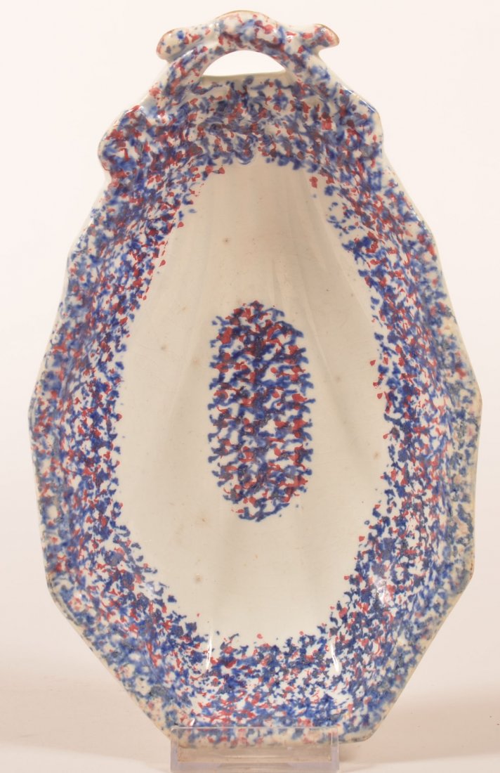 Red and Blue Sponge Decorated Ironstone China Relish: Red and Blue Sponge Decorated Ironstone China Relish Dish. Oblong form with open handle. 8-3/8" long. Condition: Very good, no damage.