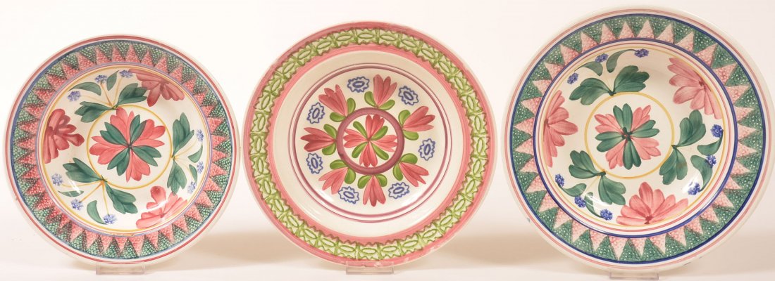 Three Polychrome Floral and foliate Design Spatter: Three Polychrome Floral and foliate Design Spatter China Soup Plates. Two are signed "Made in Belgium". 9-3/4" to 11" diam. Condition: Very good, no damage.