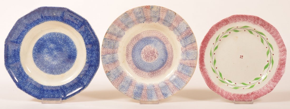 Three Spatterware Ironstone China Plates. 1st: Red: Three Spatterware Ironstone China Plates. 1st: Red spatter "holly berry" pattern 9-1/4" paneled plate. 2nd: Purple and blue rainbow pattern 10-1/8" soup plate. 3rd: Blue spatter 9-7/8" paneled plate. 