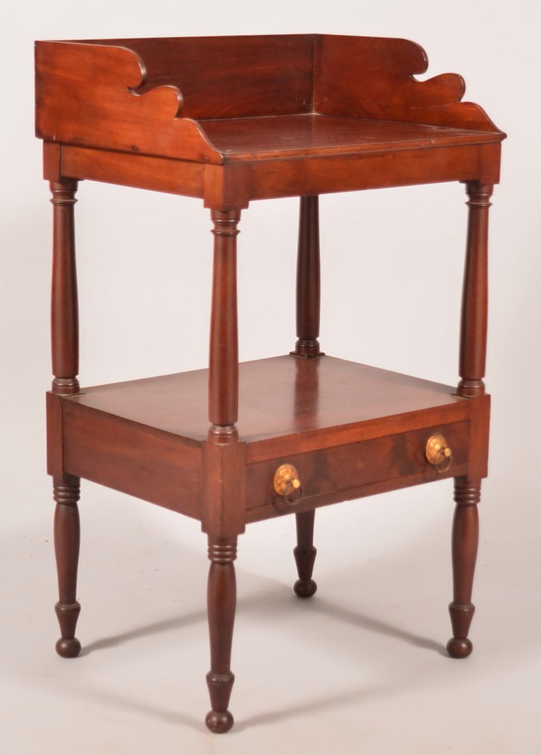 Sheraton Mahogany Washstand. Shaped splash-back Lower: Sheraton Mahogany Washstand. Shaped splash-back Lower dovetailed drawer and turned legs. 35-1/2"h. x 20-1/2"w. x 16"d.Condition: Good with wear and some cracks.