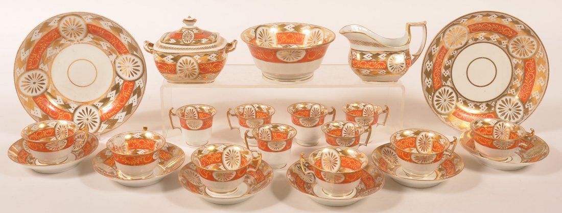 23 Piece 19th Century Porcelain Partial Tea/Chocolate: 23 Piece 19th Century Porcelain Partial Tea/Chocolate Service, Pattern 6967, Attributed to Coalport. Bold Orange and gold rosette geometric and scroll design. Set consists of a covered sugar bowl, cre